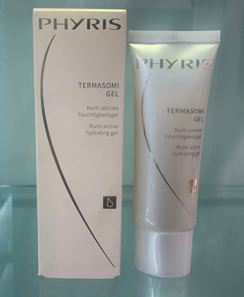A tube of phyris termaskin gel is sitting next to its box.
