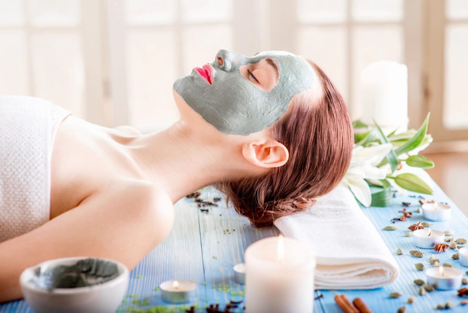 A woman with facial mask on her face.